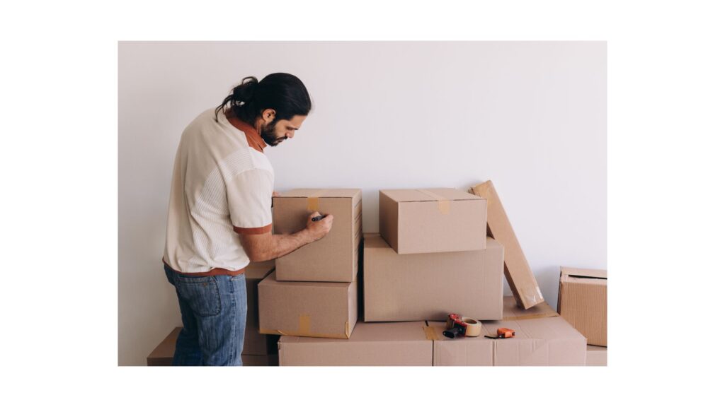 man writing the box